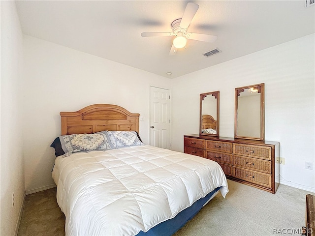 bedroom with ceiling fan and light colored carpet