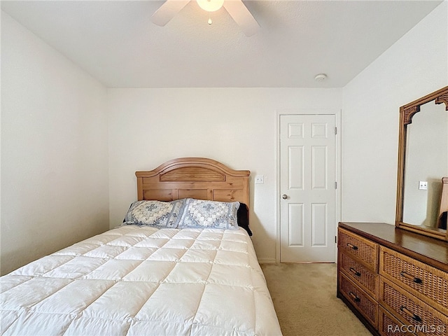 bedroom featuring ceiling fan and light colored carpet