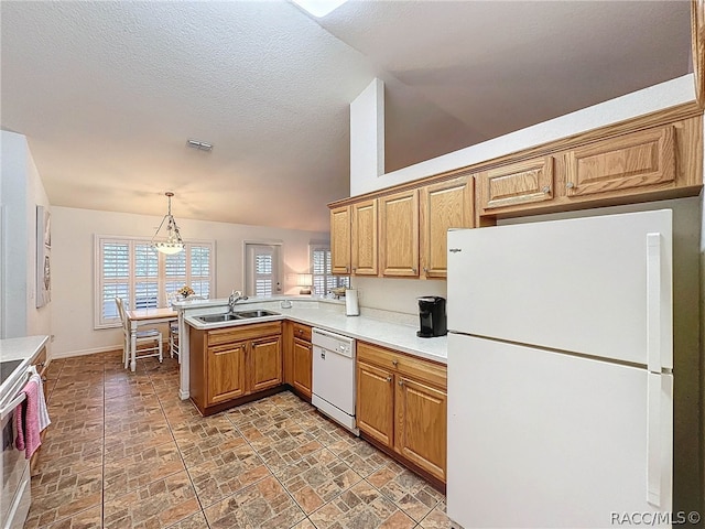 kitchen with pendant lighting, white appliances, an inviting chandelier, sink, and kitchen peninsula