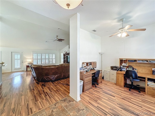 office space featuring ceiling fan, vaulted ceiling, and hardwood / wood-style flooring