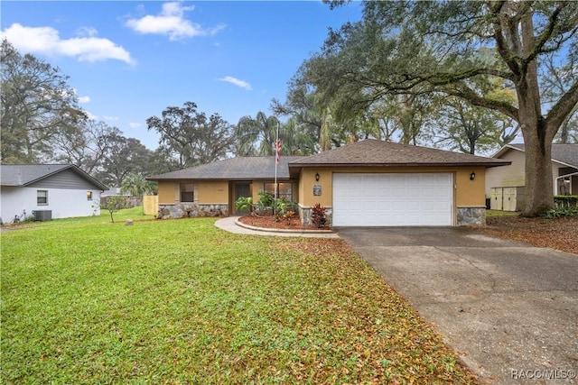 ranch-style house featuring central AC, an attached garage, stone siding, aphalt driveway, and a front lawn