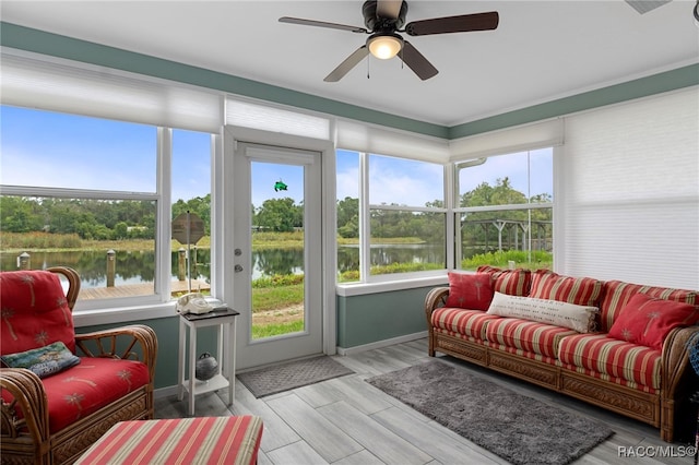 4306 E Gloria Dr, Hernando, FL 34442 - sunroom featuring a water view and baseboards