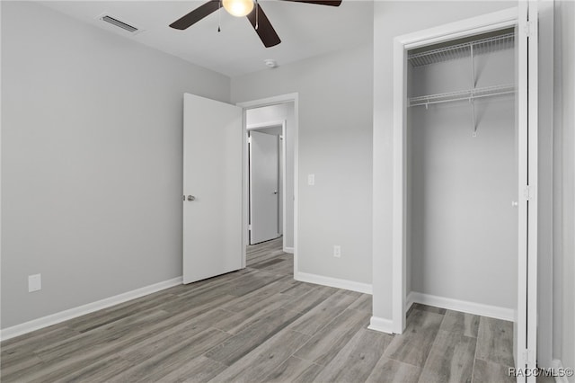4306 E Gloria Dr, Hernando, FL 34442 - unfurnished bedroom featuring wood finished floors, a closet, and ceiling fan