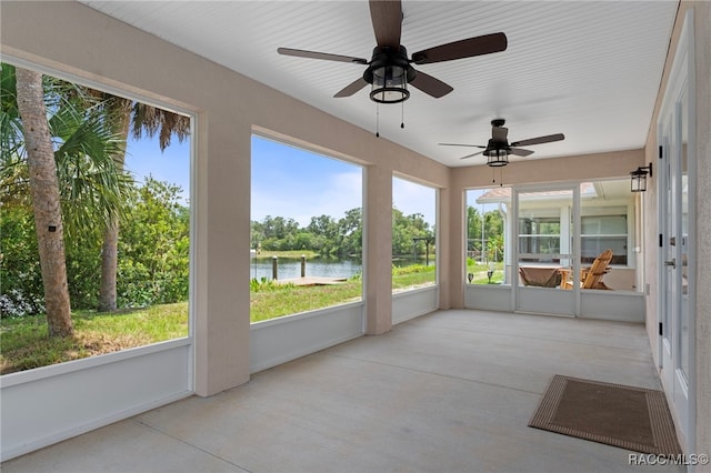 4306 E Gloria Dr, Hernando, FL 34442 - unfurnished sunroom with a water view, ceiling fan, and plenty of natural light