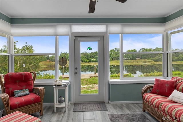 4306 E Gloria Dr, Hernando, FL 34442 - sunroom / solarium with a water view, wood finished floors, and view of scattered trees