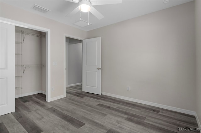 4306 E Gloria Dr, Hernando, FL 34442 - unfurnished bedroom featuring a closet, wood finished floors, and a ceiling fan