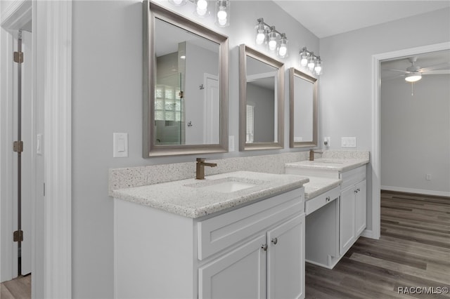 4306 E Gloria Dr, Hernando, FL 34442 - full bath with double vanity, a ceiling fan, wood finished floors, and a shower with door
