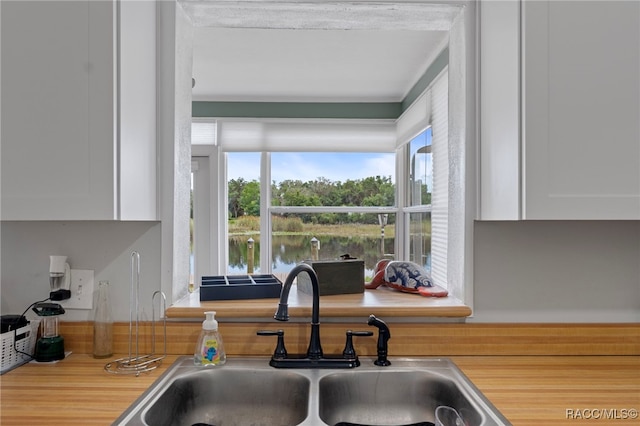 4306 E Gloria Dr, Hernando, FL 34442 - kitchen featuring white cabinetry and light countertops