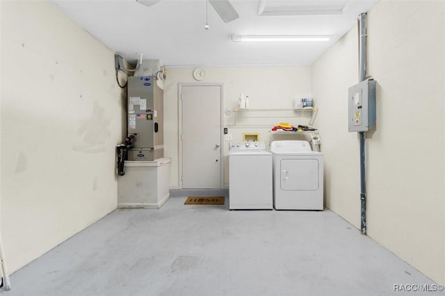 washroom featuring washer and clothes dryer and heating unit