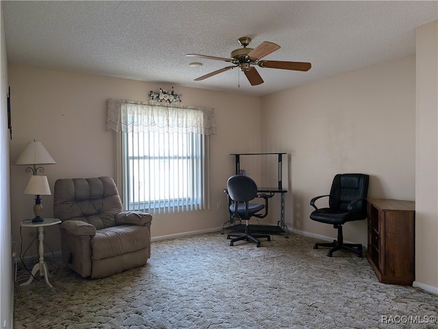 home office with carpet, a textured ceiling, and ceiling fan