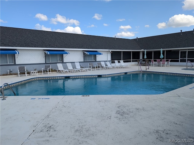 view of pool featuring a patio area