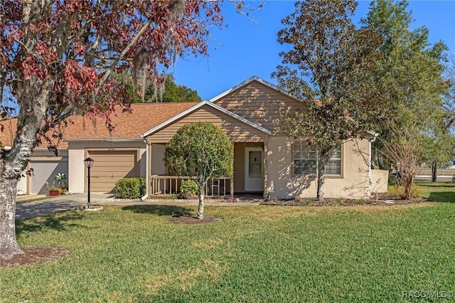 view of front of house with a garage and a front lawn