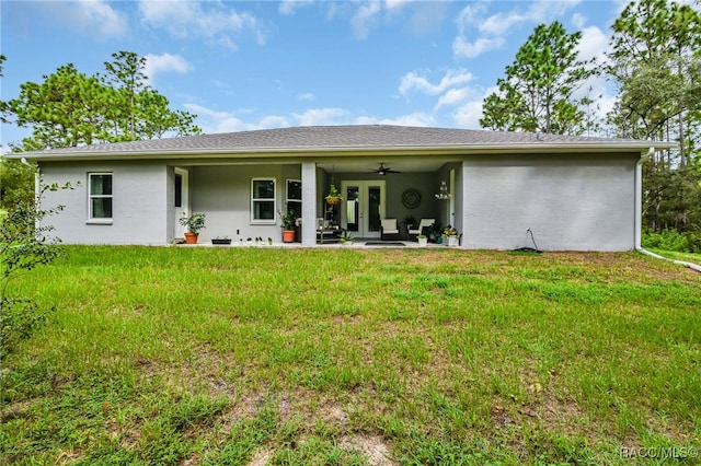 back of house with a lawn, ceiling fan, and a patio area