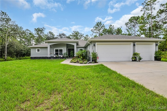 view of front of house with a garage and a front yard