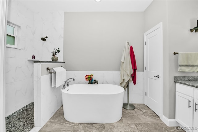 bathroom with vanity and independent shower and bath