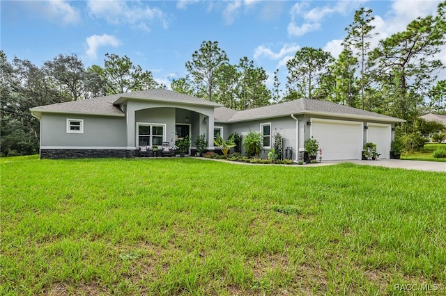 single story home with a front yard and a garage