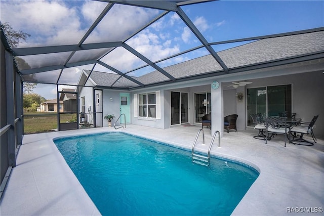 pool featuring a ceiling fan and a patio area