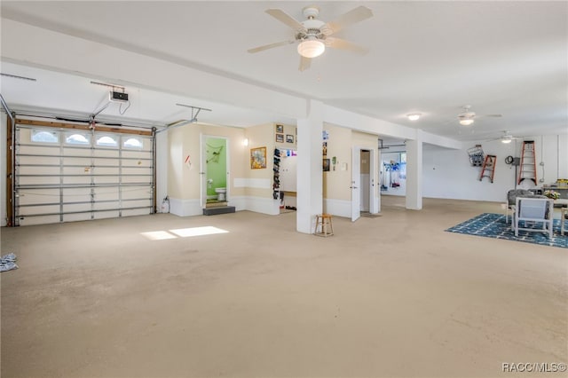 garage with ceiling fan and a garage door opener