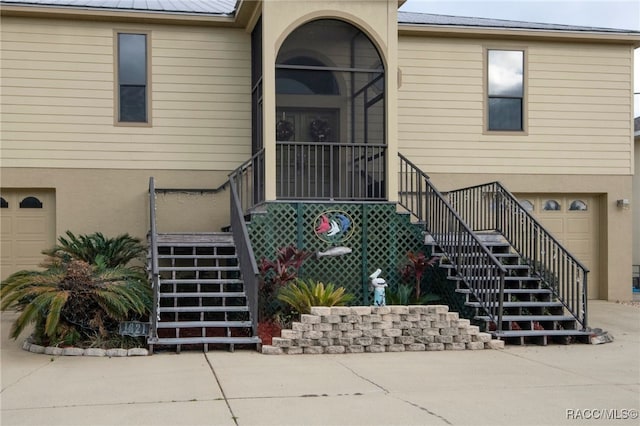 property entrance with a garage