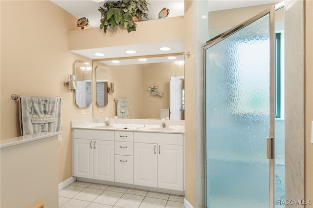 bathroom with vanity, tile patterned floors, and walk in shower