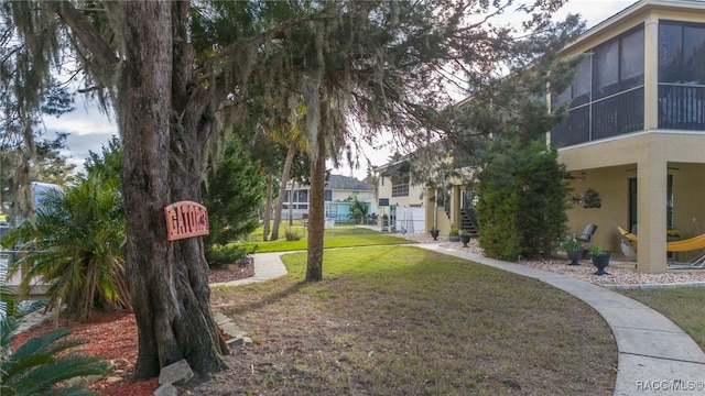 view of yard featuring a sunroom