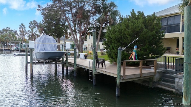 dock area with a water view