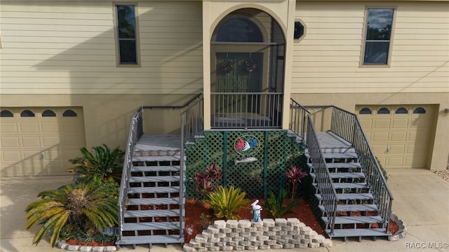 view of exterior entry with a garage