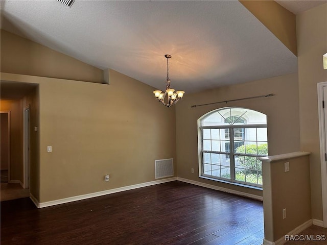 empty room with dark wood-style floors, visible vents, baseboards, a chandelier, and lofted ceiling