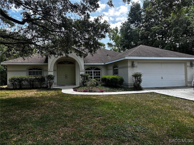 single story home with an attached garage, concrete driveway, a front yard, and stucco siding