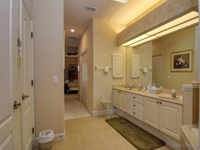 bathroom featuring vanity and a textured ceiling