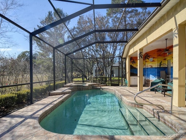 view of swimming pool with a lanai, ceiling fan, an in ground hot tub, and a patio