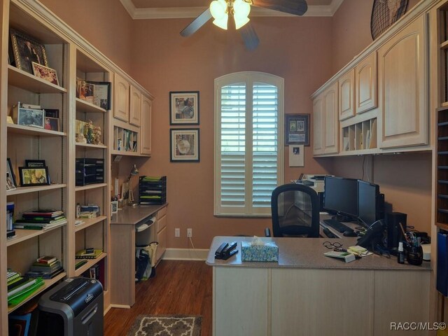 office area featuring ceiling fan, dark wood-type flooring, and ornamental molding