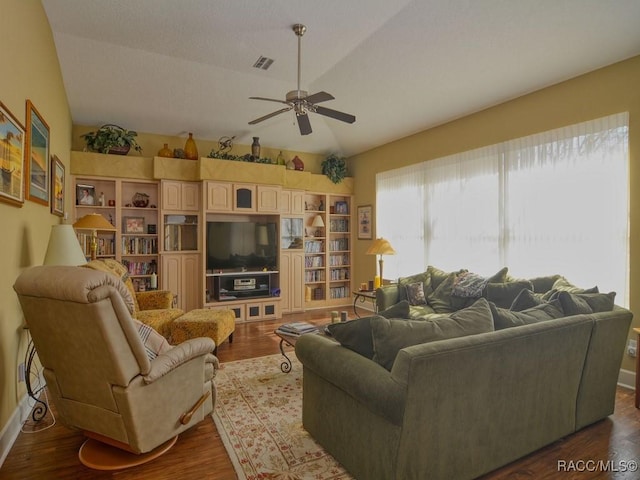 living room with lofted ceiling, ceiling fan, plenty of natural light, and hardwood / wood-style floors