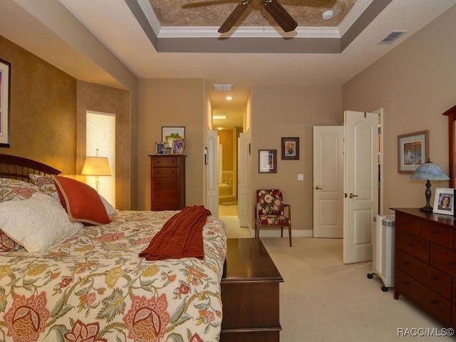 bedroom with light carpet, ceiling fan, ornamental molding, and a raised ceiling