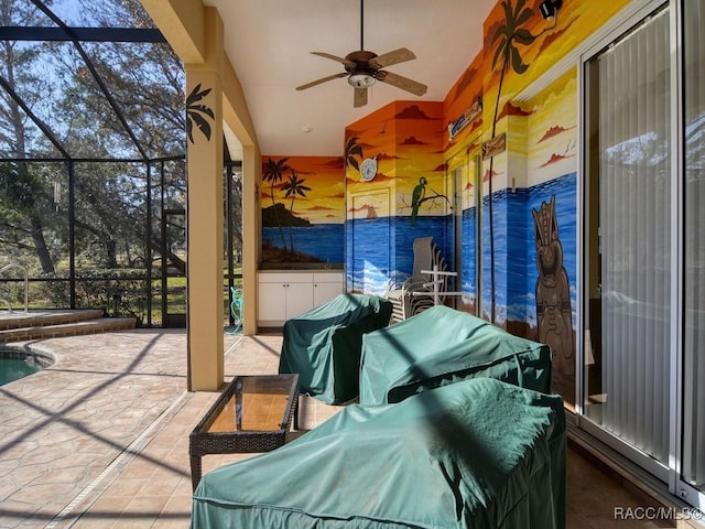 view of patio with ceiling fan, a grill, and a lanai