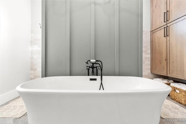 bathroom featuring a tub