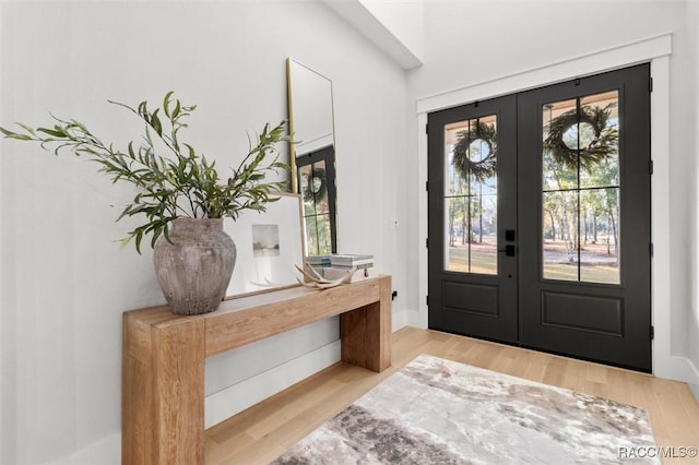 entryway with french doors and light wood-type flooring