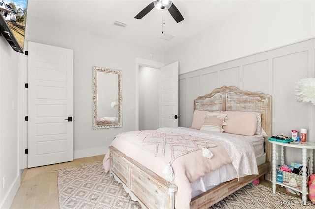 bedroom with ceiling fan and light wood-type flooring