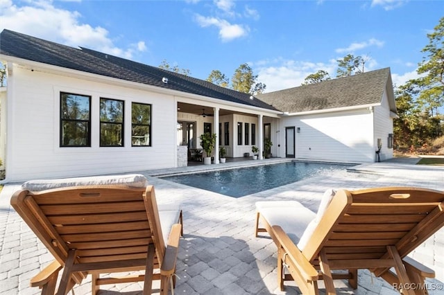 exterior space with ceiling fan and a patio area