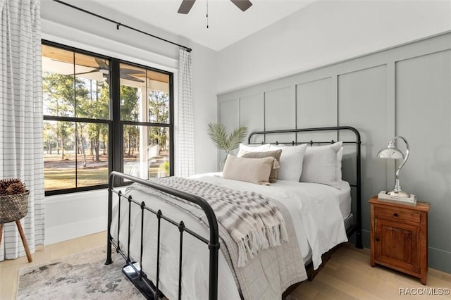 bedroom with ceiling fan and light hardwood / wood-style floors