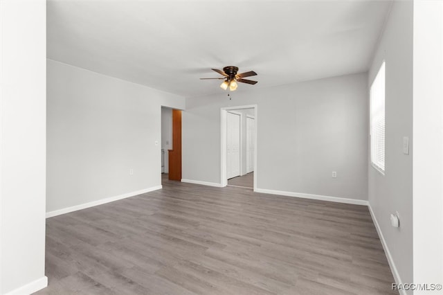 unfurnished room featuring ceiling fan and wood-type flooring