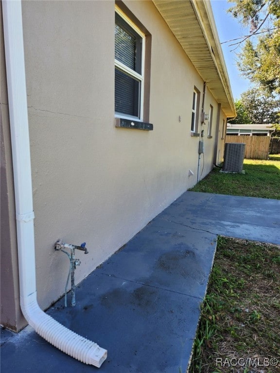 view of property exterior with central AC