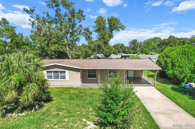 single story home with a front lawn and a carport