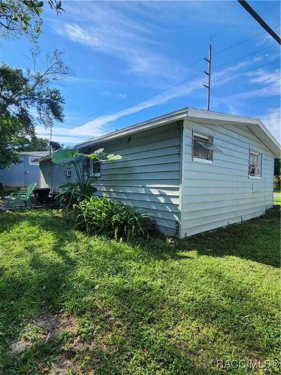 view of home's exterior featuring a yard