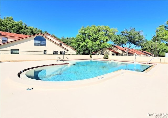 view of pool featuring a patio area