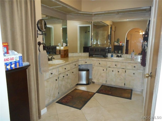 bathroom with tile patterned flooring and vanity