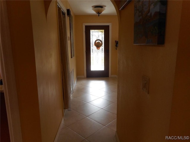 entryway with light tile patterned floors