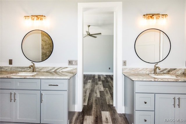 bathroom featuring ceiling fan, vanity, and hardwood / wood-style flooring