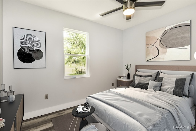 bedroom featuring hardwood / wood-style floors and ceiling fan