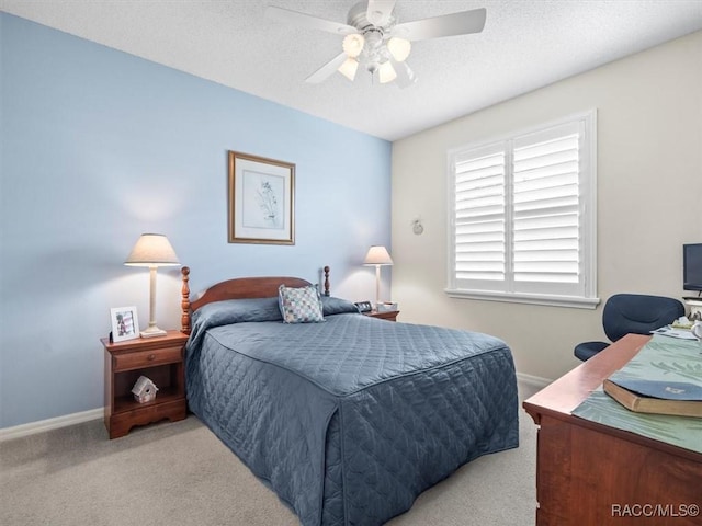 18514 Hidden Pines Way, Hudson, FL 34667 - bedroom with carpet flooring, baseboards, a desk, and a textured ceiling